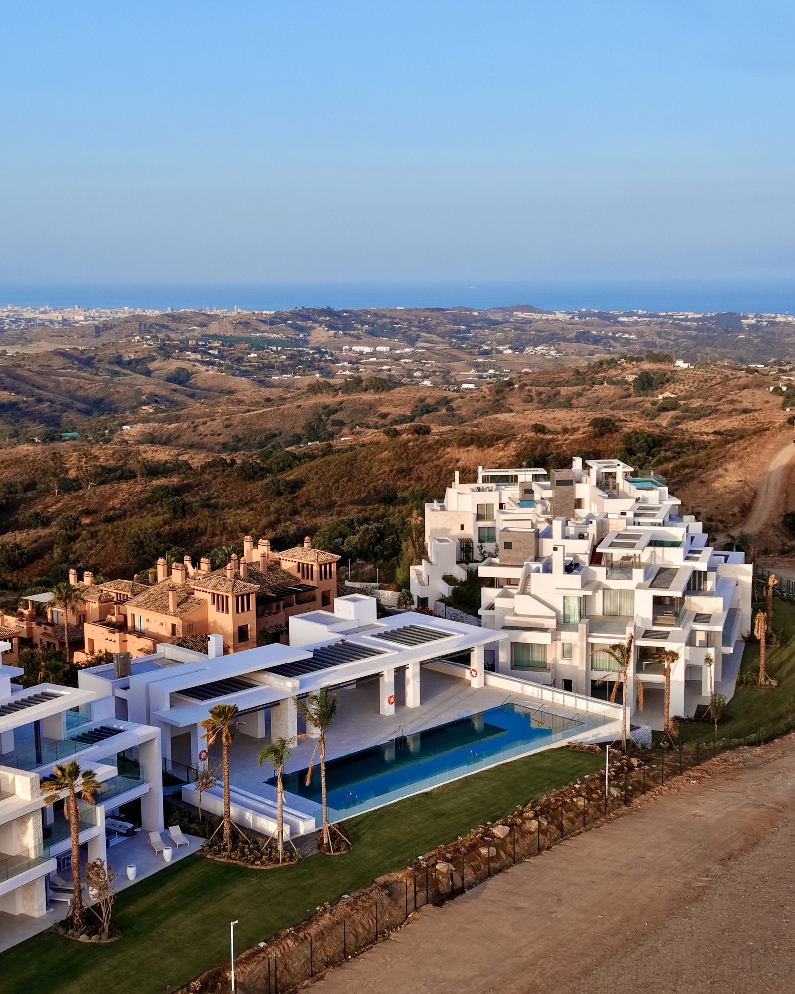 Aerial of a development with pool and sea