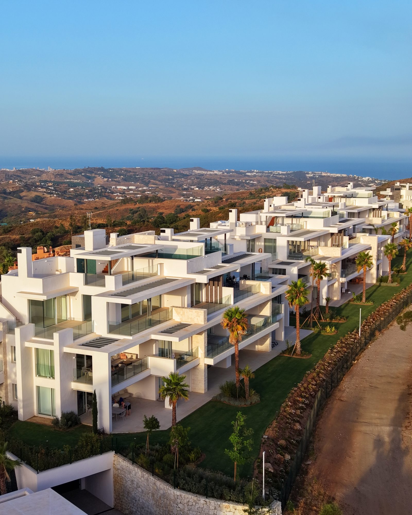 Aerial of stepped white apartments