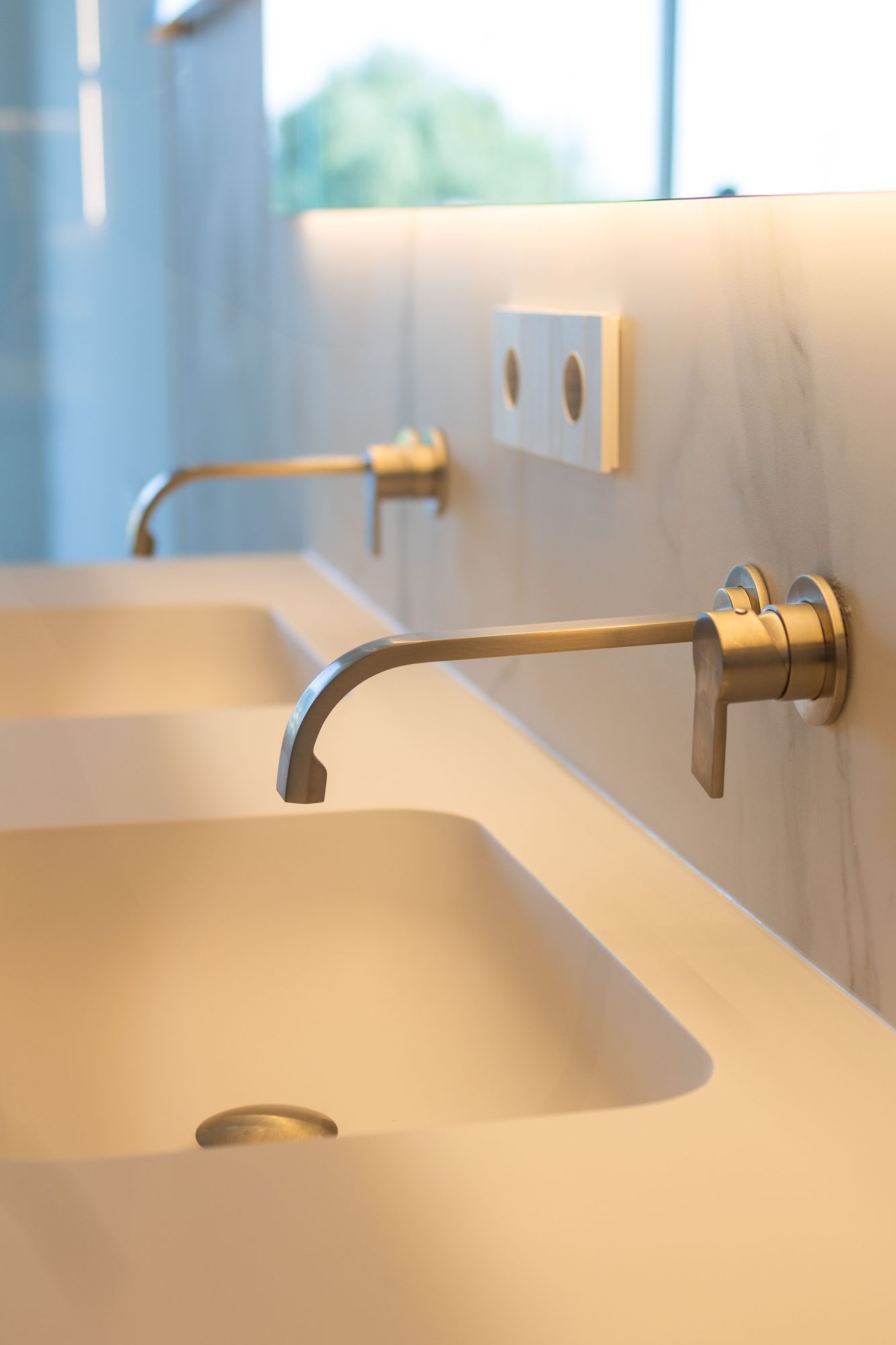 Marble basin with brass wall taps