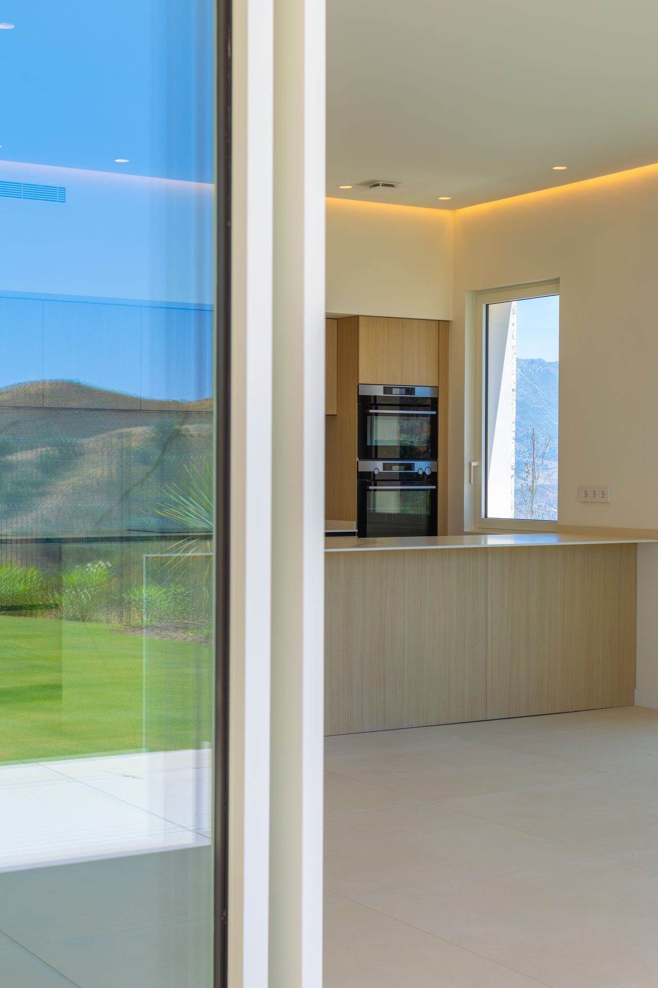 Kitchen with glass doors and mountain view