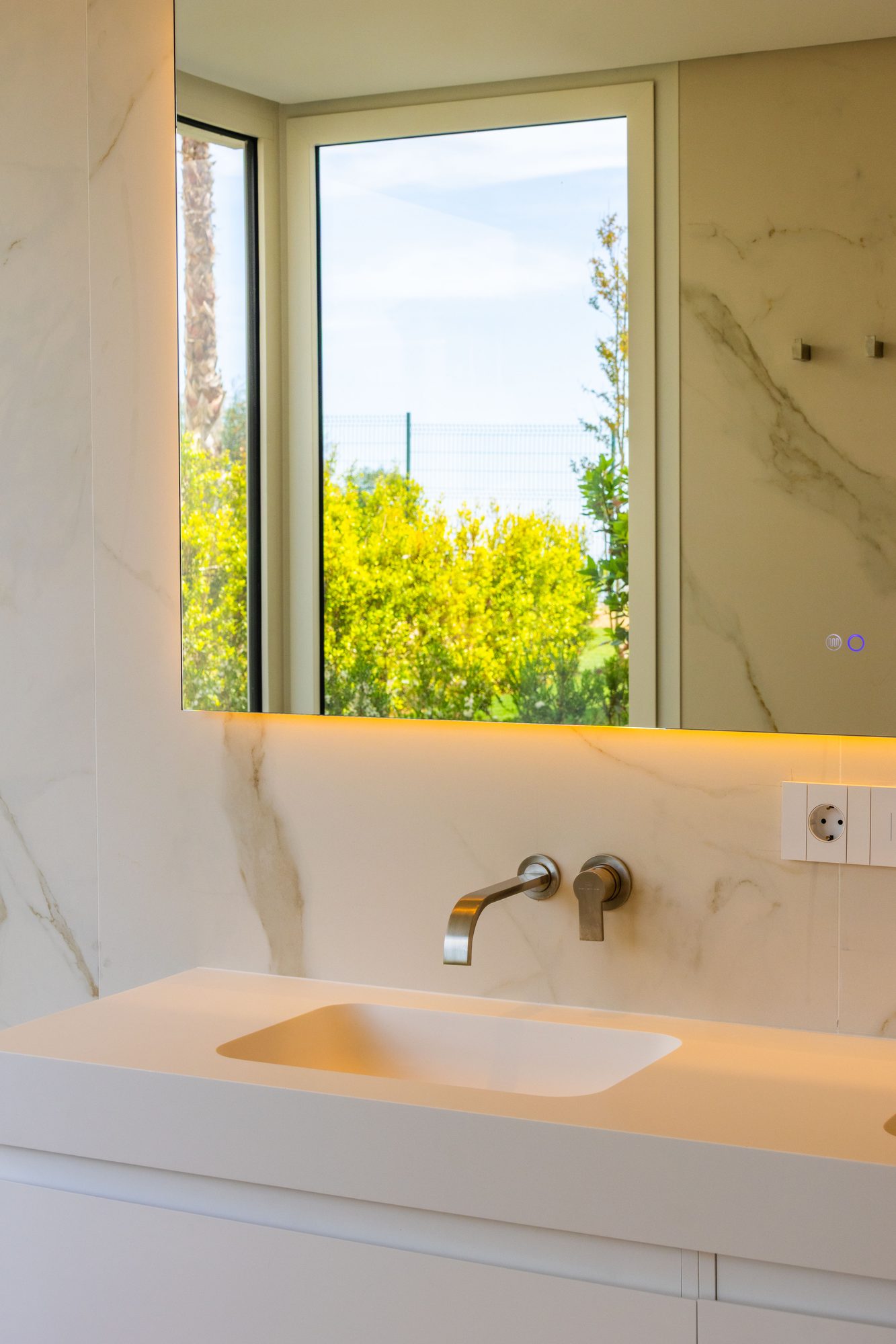 Marble basin beneath a garden window