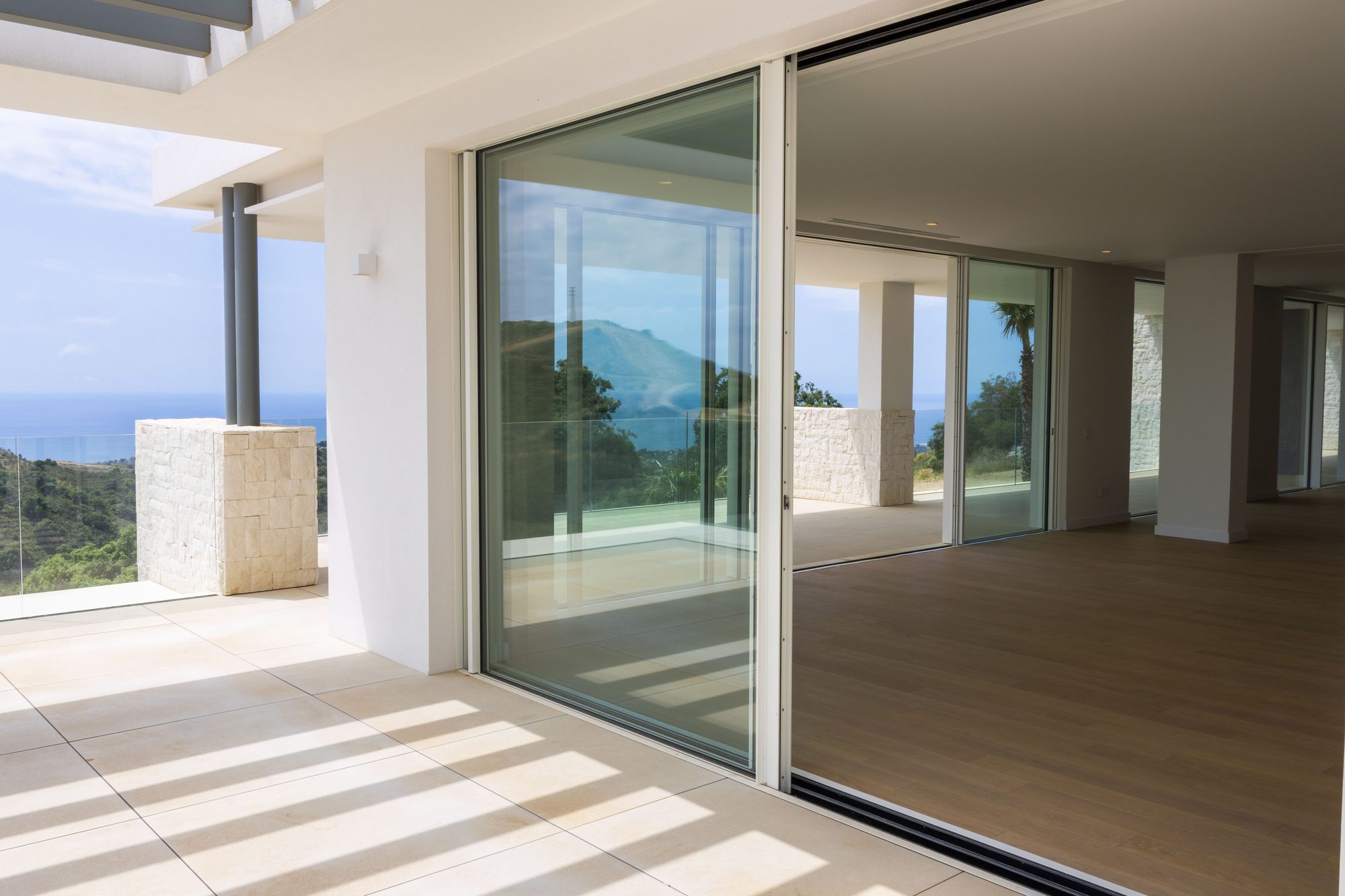 Living space opening through sliding glass