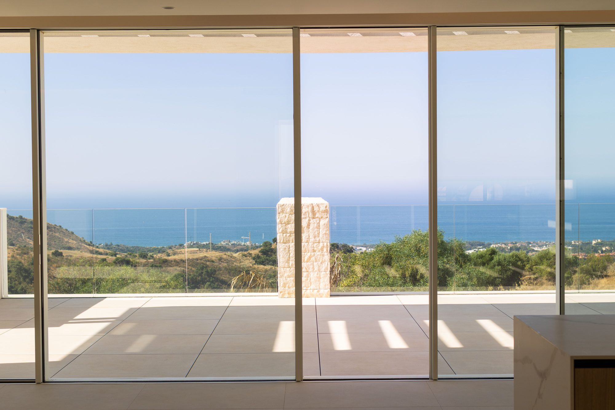 Glass doors framing a sea view