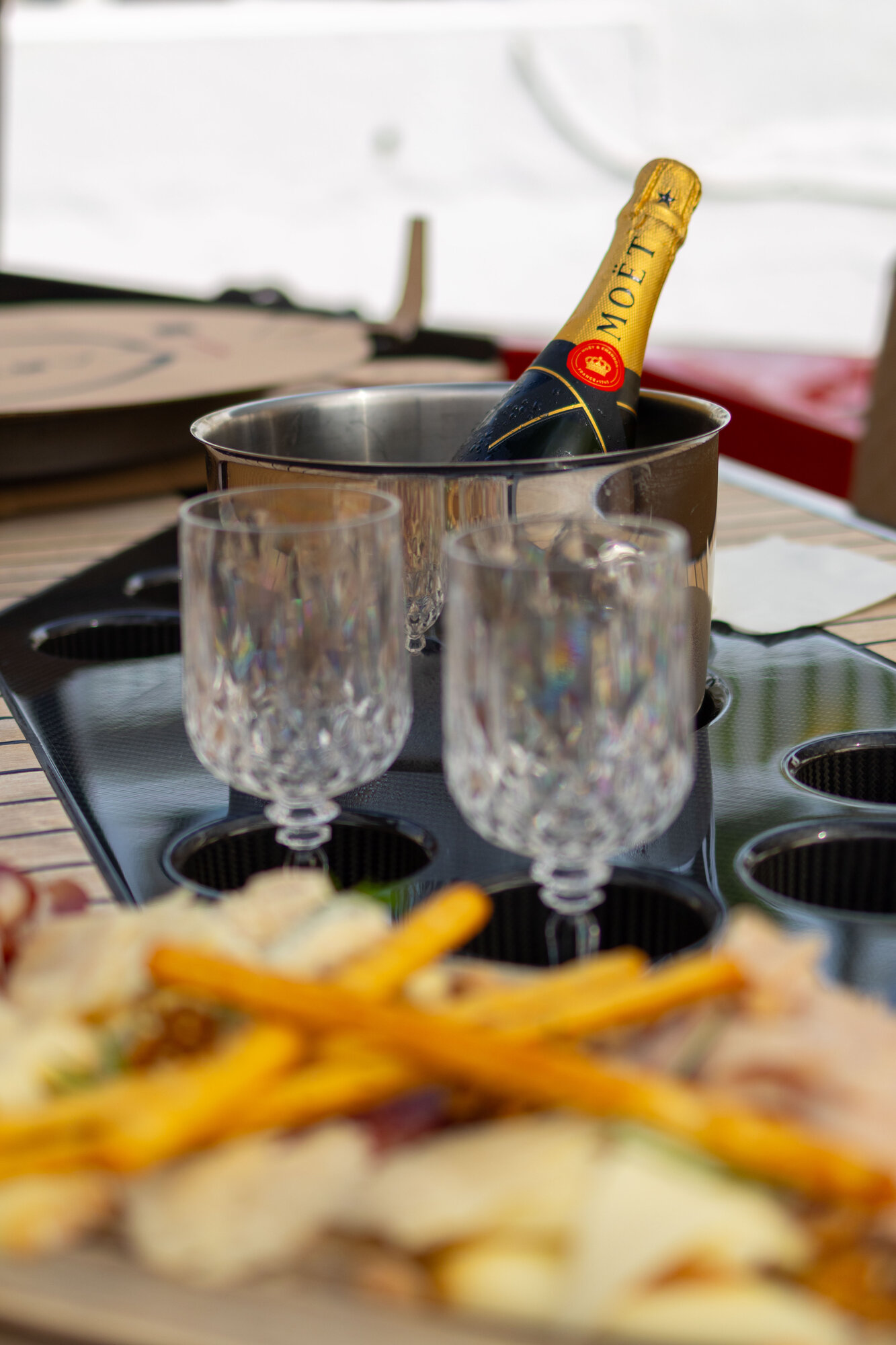 Champagne and crystal glasses on deck